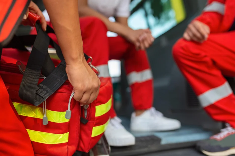 Emergency responders with medical bag