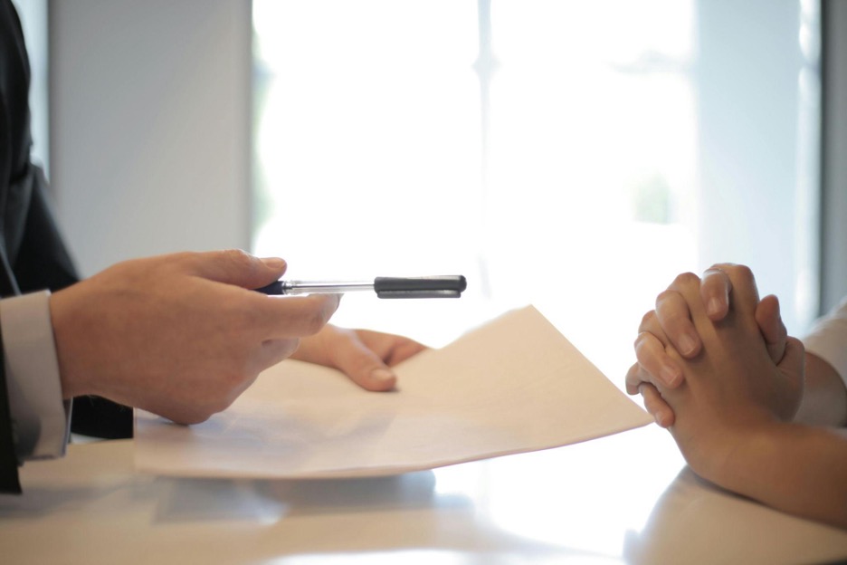 person signing papers