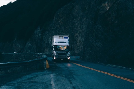 Truck driving on a mountain road