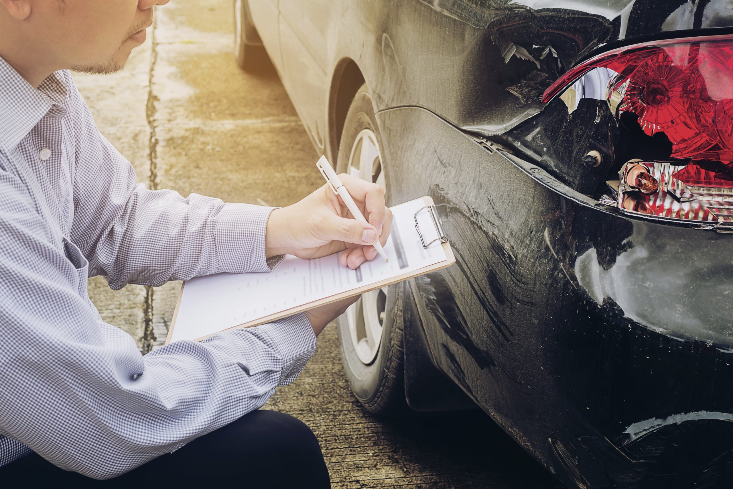 insurance agent checking damages